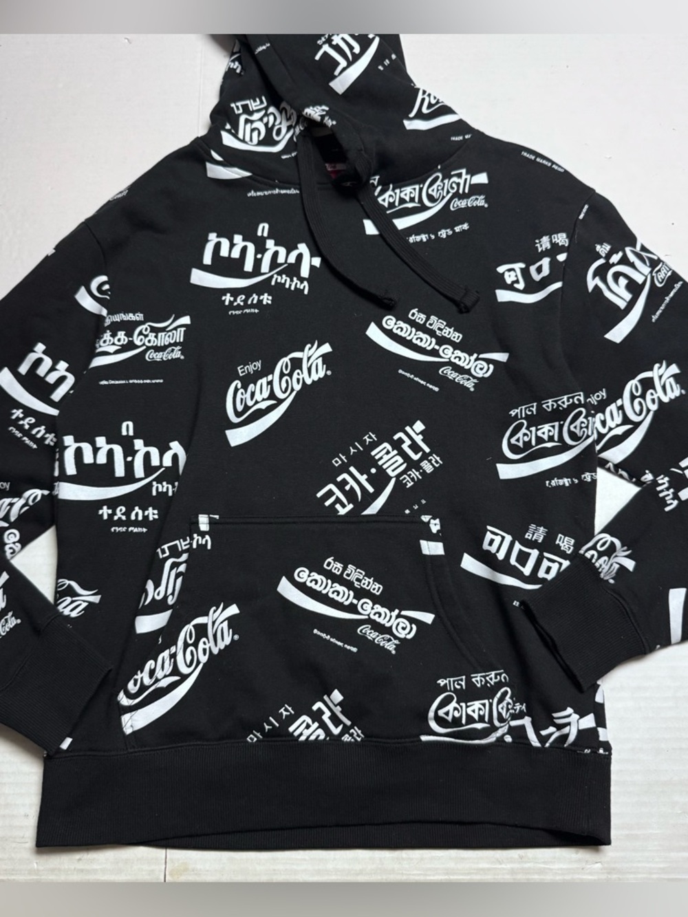 Coca-Cola All Over Language Unisex Hoodie Black, White Size: Small Relaxed Fit